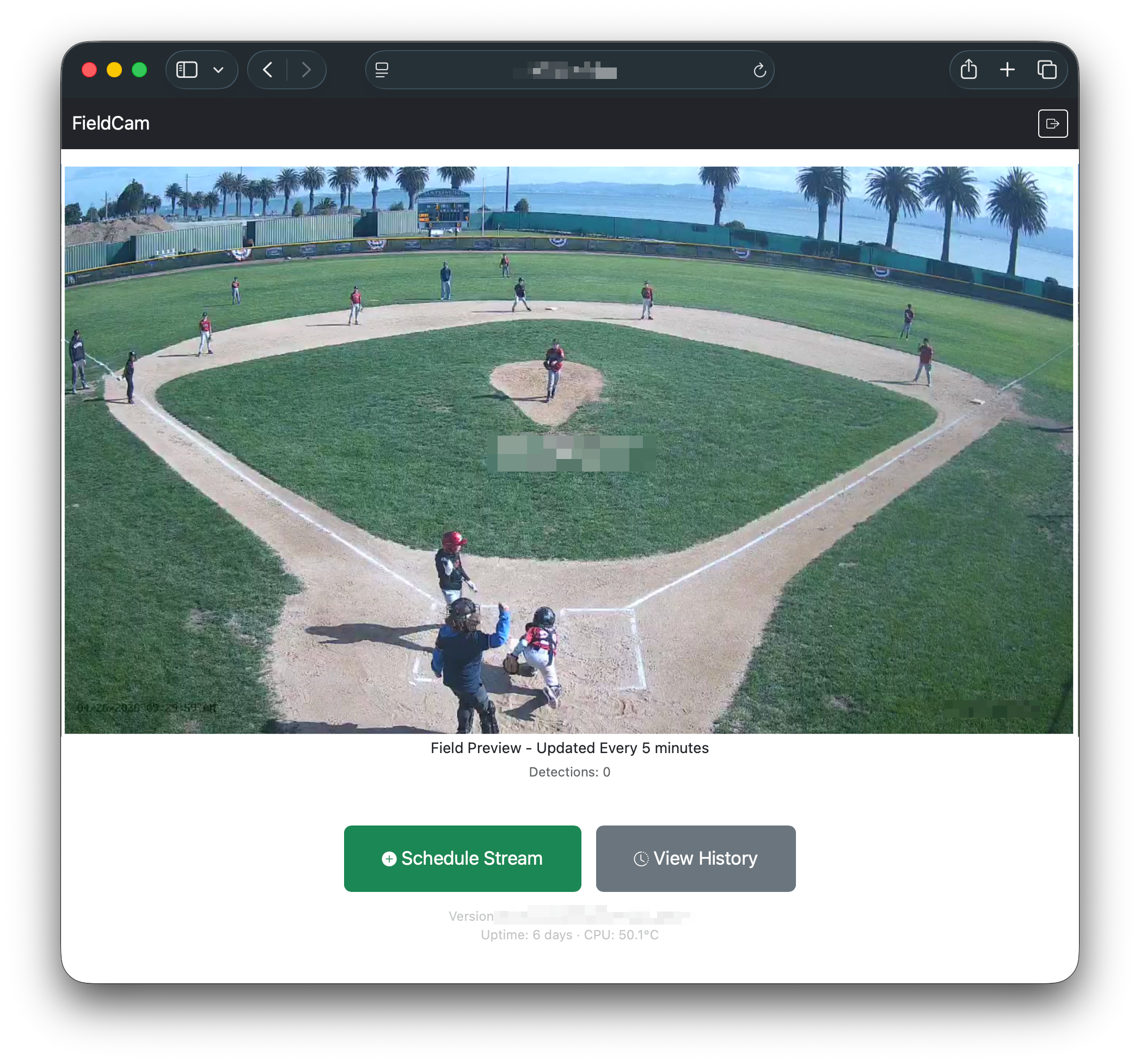Wide view of a baseball infield from behind home plate